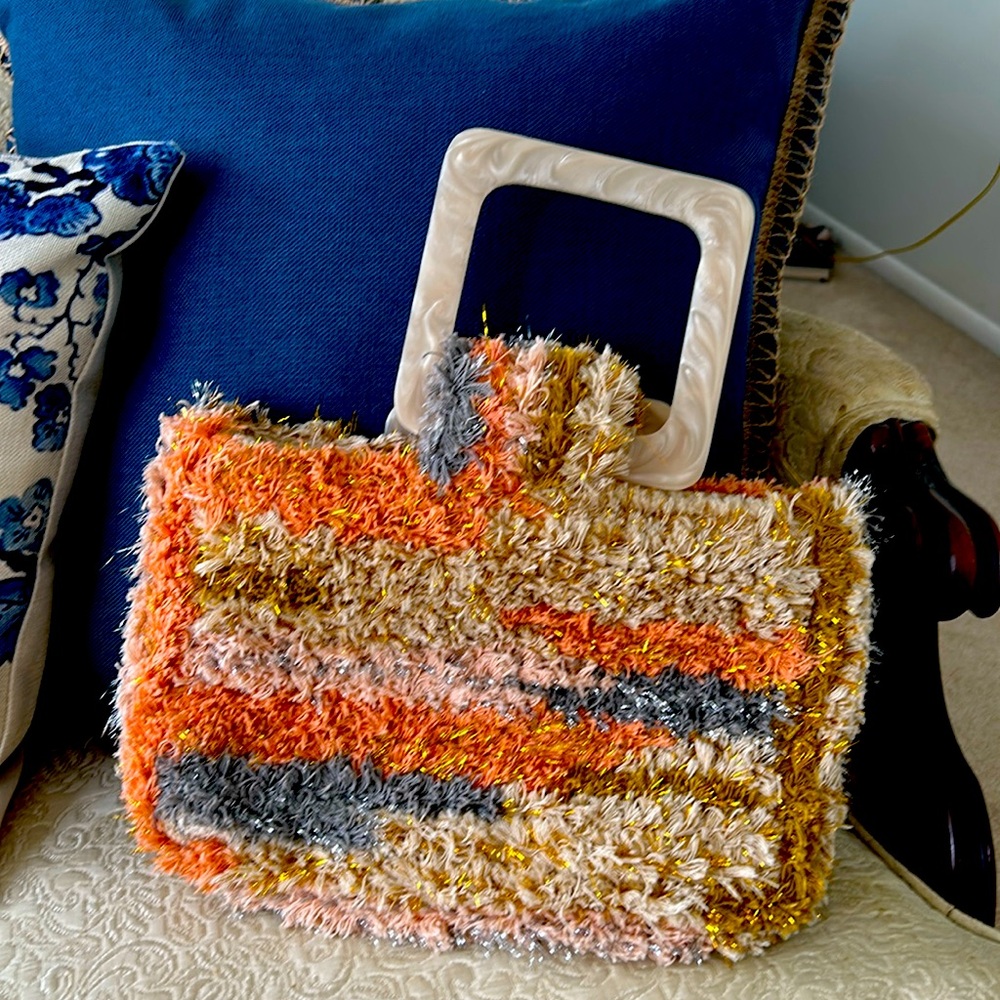 This handbag has charm and would definitely turn heads-true conversation piece.